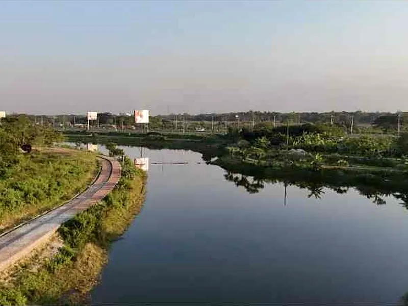 Lake and lakeside walkway in Purbachal Sector 5, from a drone