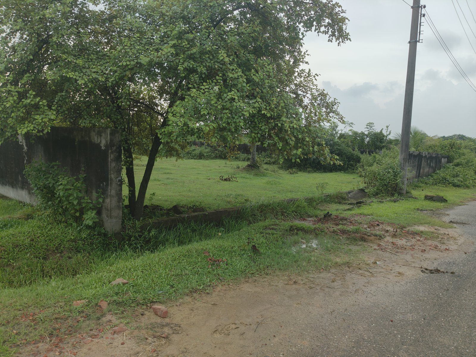 Boundary wall view of the 10 katha plot in Purbachal Sector 10